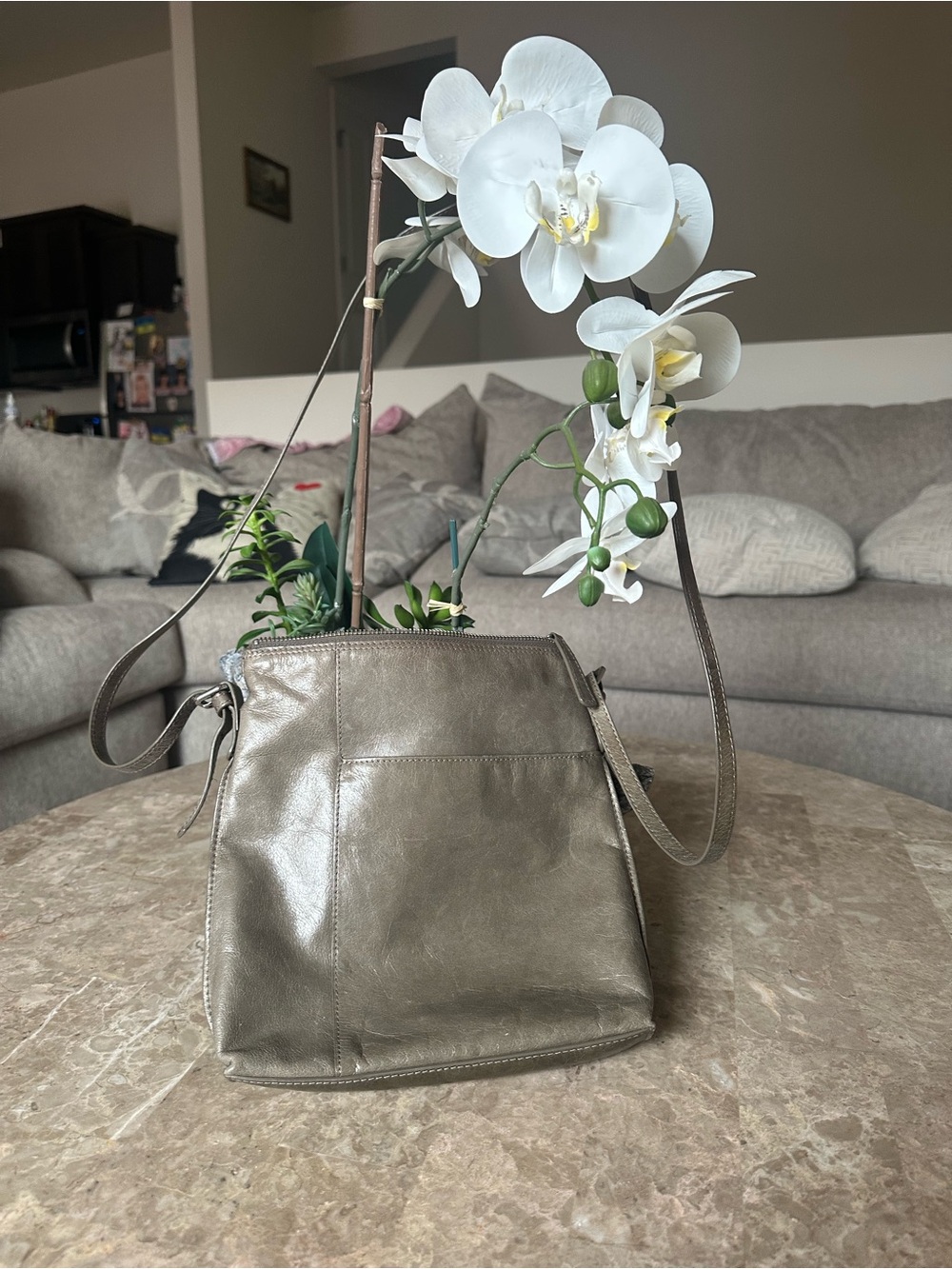 HOBO
International gray leather zip-top crossbody purse.
